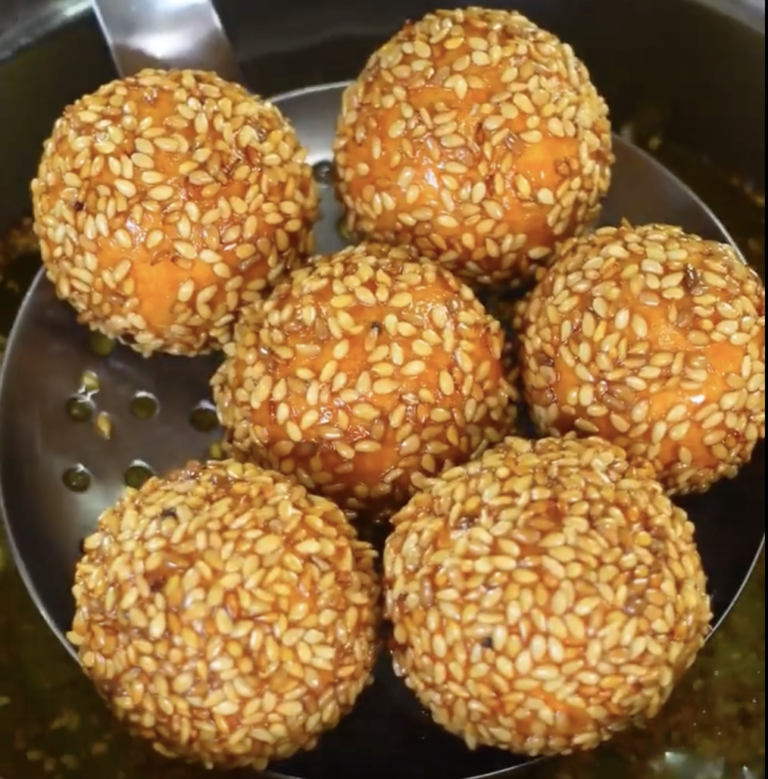 sesame sweet potato balls in colander